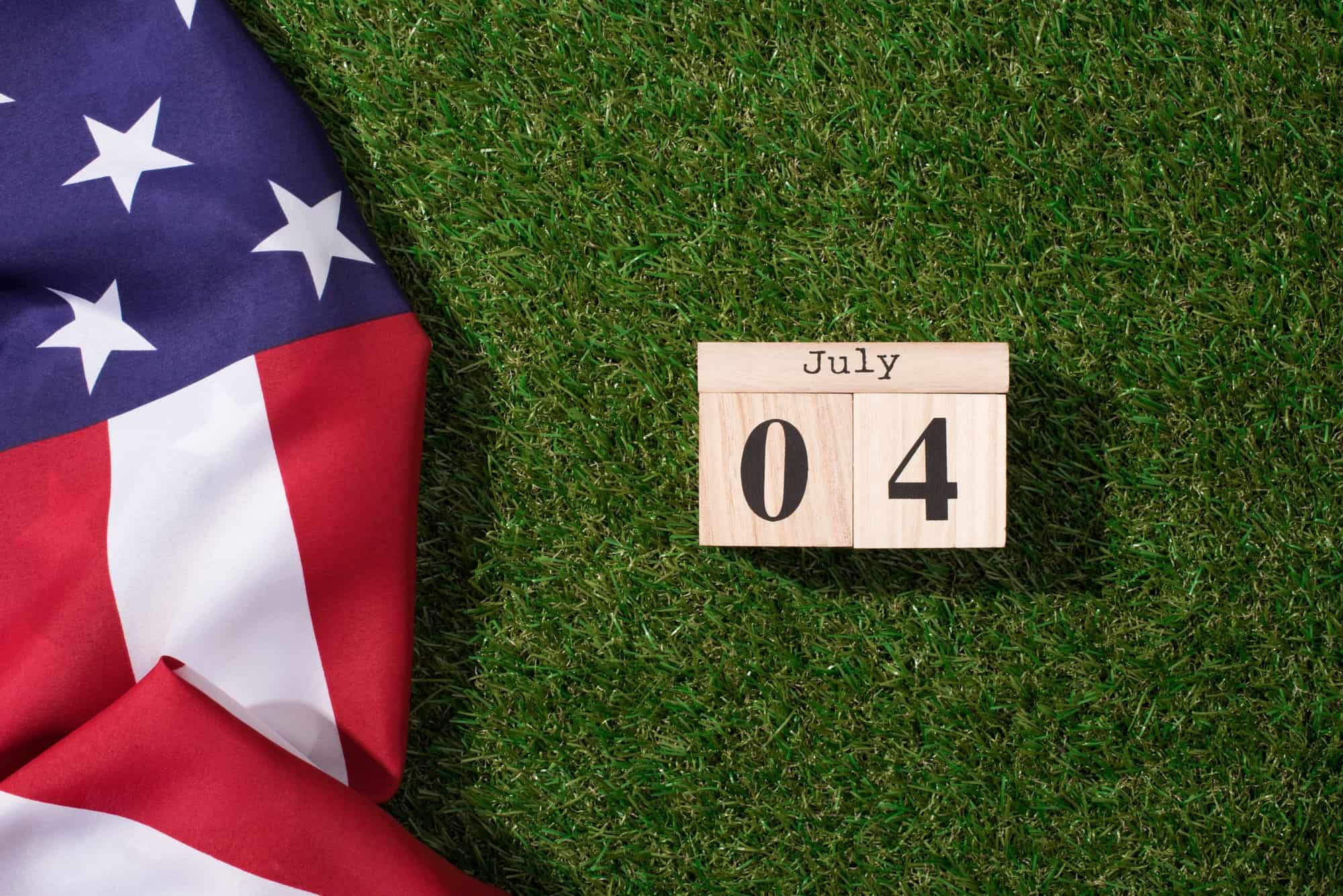 American Flag And Wooden Calendar With 4th July Date